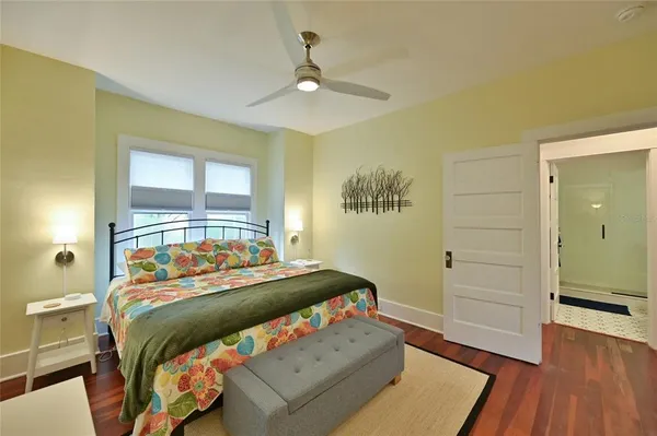 a bedroom with a bed and a window