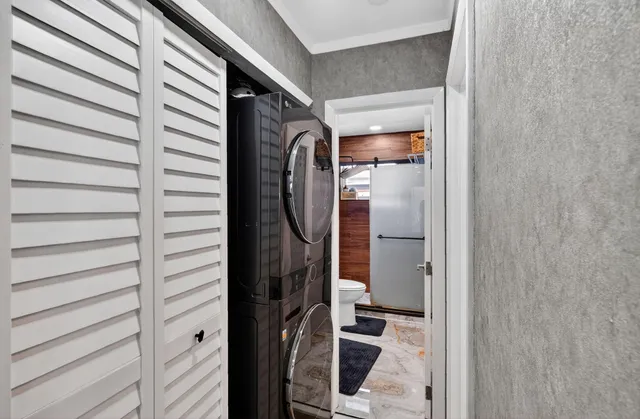 a couple of potted plants in front of door