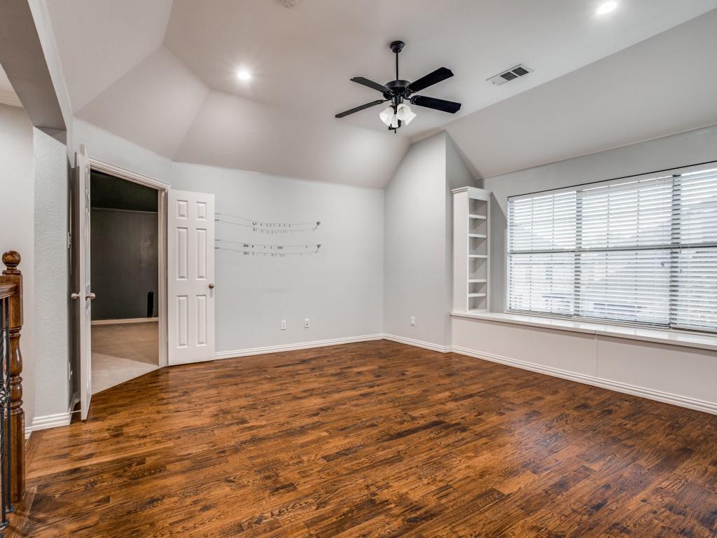 9609 Sam Bass Trail Fort Worth, TX 76244 - Photo 15 of 25 a view of an empty room with a window and wooden floor