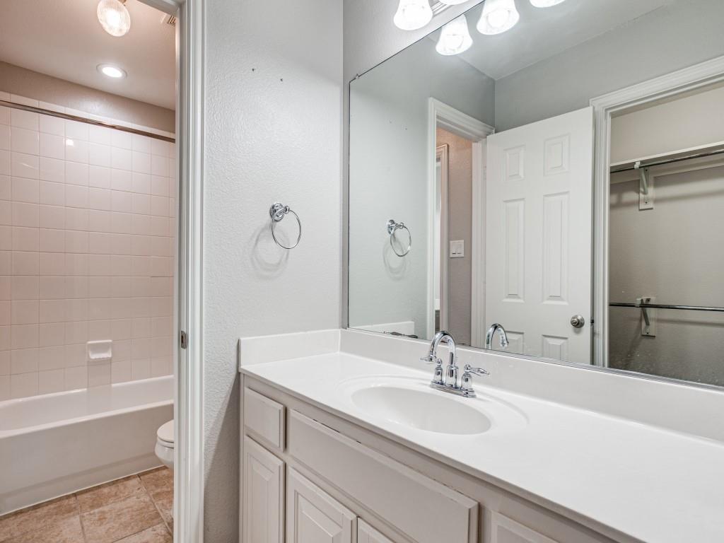 9609 Sam Bass Trail Fort Worth, TX 76244 - Photo 18 of 25 a bathroom with a bathtub and a sink