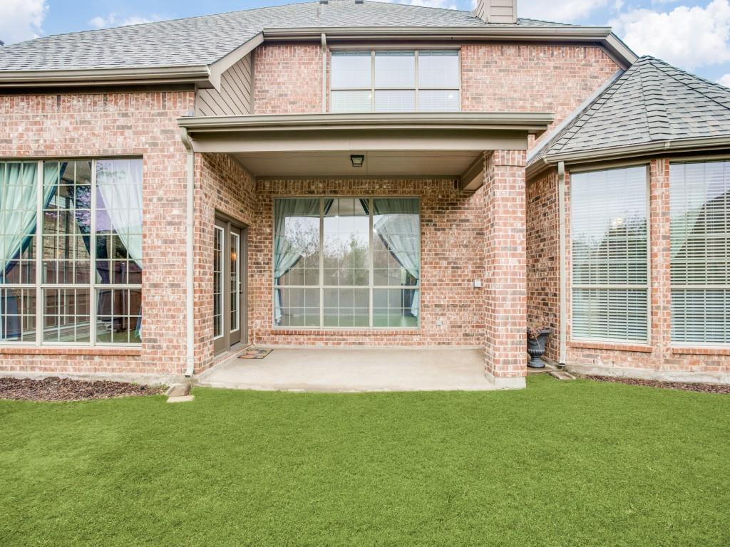 9609 Sam Bass Trail Fort Worth, TX 76244 - Photo 24 of 25 a front view of a house with a garden and plants