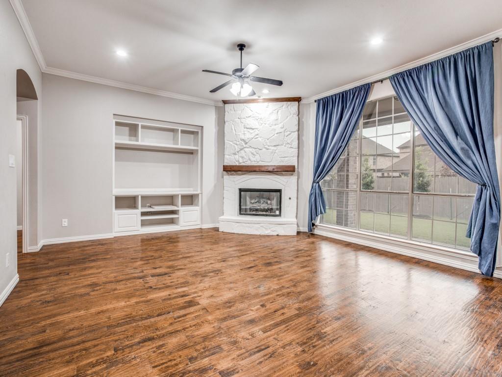 9609 Sam Bass Trail Fort Worth, TX 76244 - Photo 9 of 25 a view of an empty room with a window and wooden floor