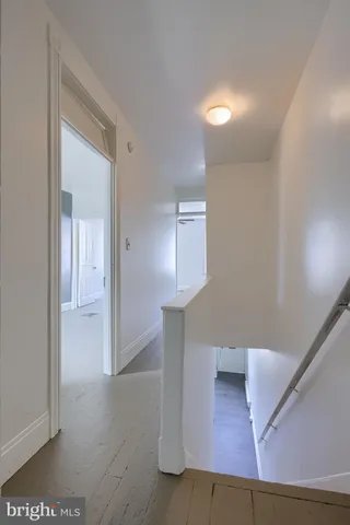 a view of a hallway with staircase