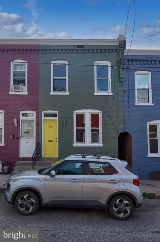 a front view of a house with parking space
