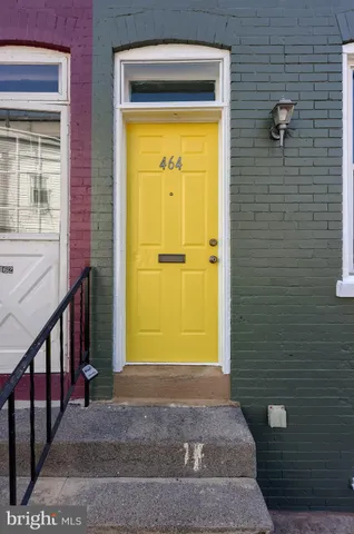 a car parked in front of a brick building