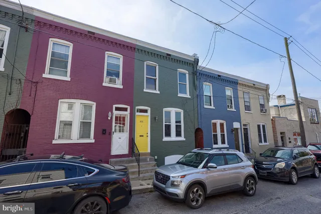 a front view of a house with parking space