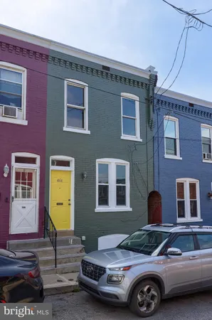 a front view of a house with parking space