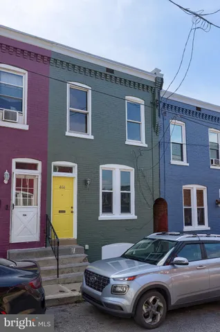 a front view of a house with parking space