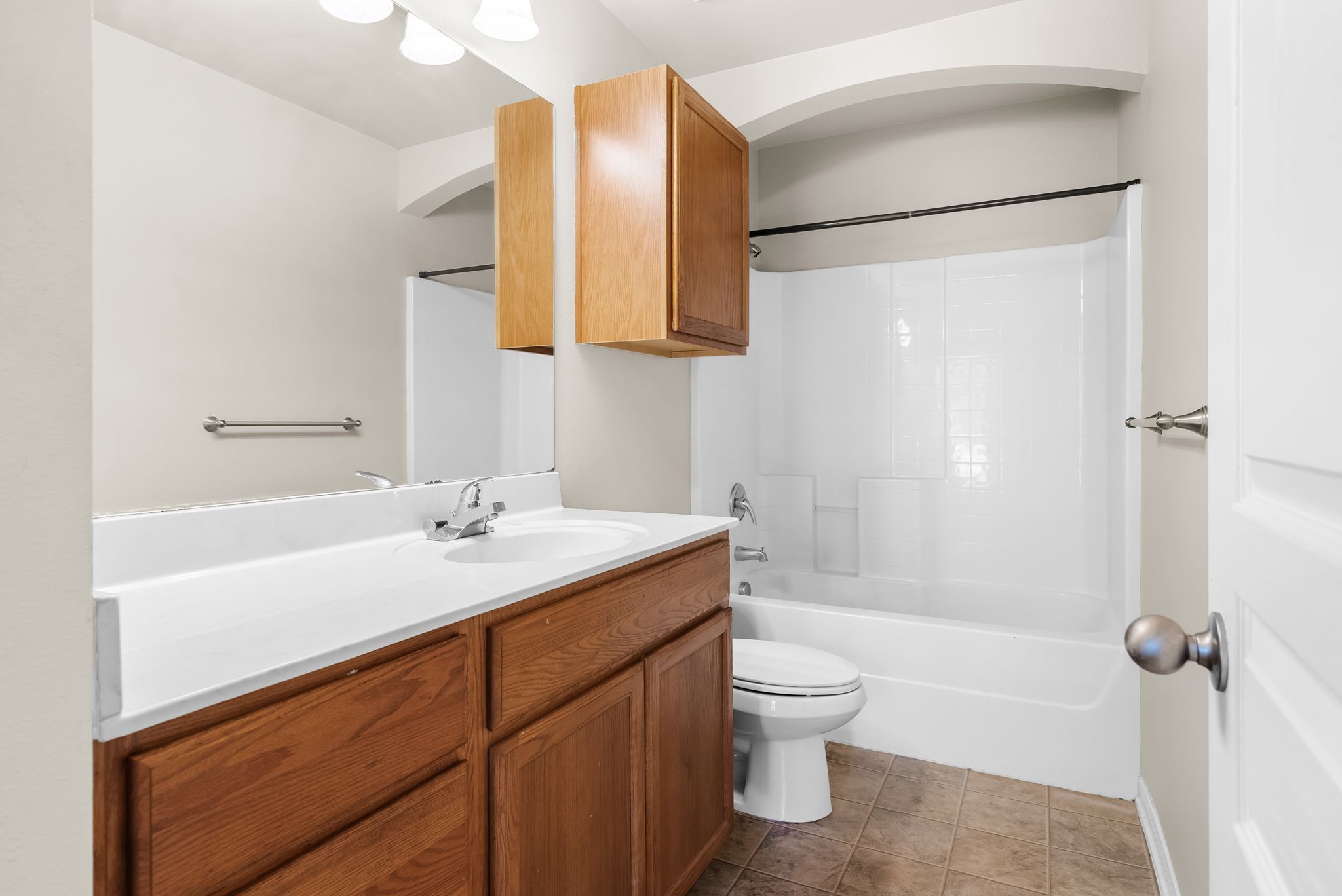 7719 Fieldstone Drive Temple, TX 76502 - Photo 6 of 37 Full bathroom with vanity, shower / bath combination, and dark tile patterned flooring