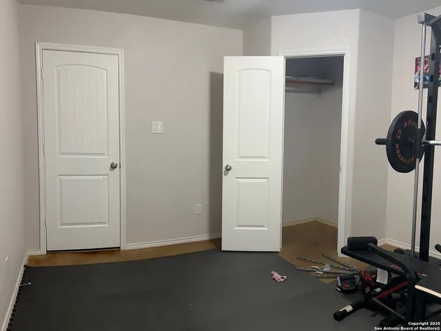 a room with gym equipment and a window