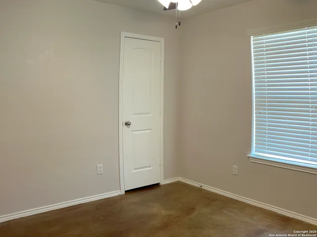 a kitchen with a refrigerator and microwave