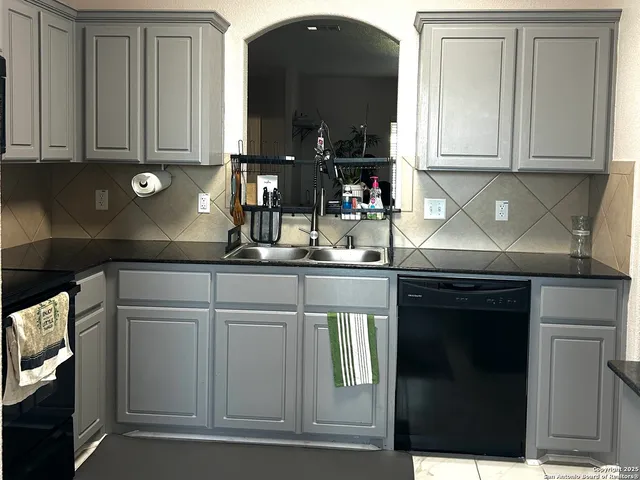 a view of a livingroom with furniture and a window