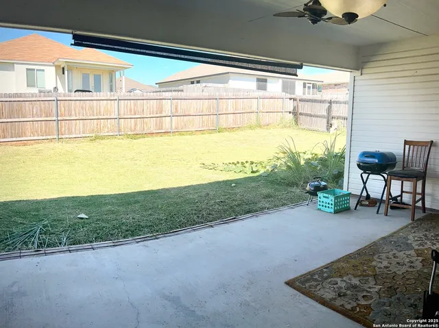 a view of a garden with lawn chairs