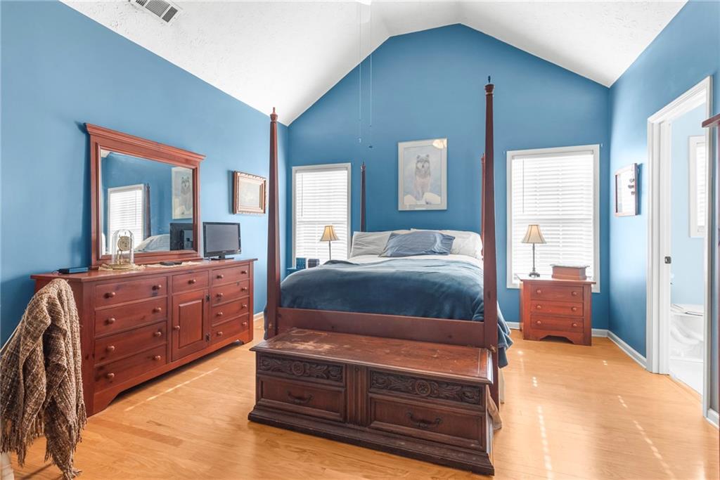 826 Hampton Way Canton, GA 30115 - Photo 11 of 17 a bedroom with a bed and a dresser