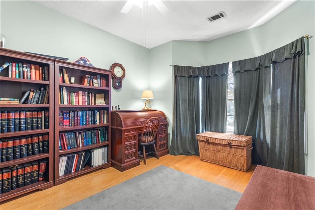 826 Hampton Way Canton, GA 30115 - Photo 16 of 17 a bedroom with furniture and a book shelf