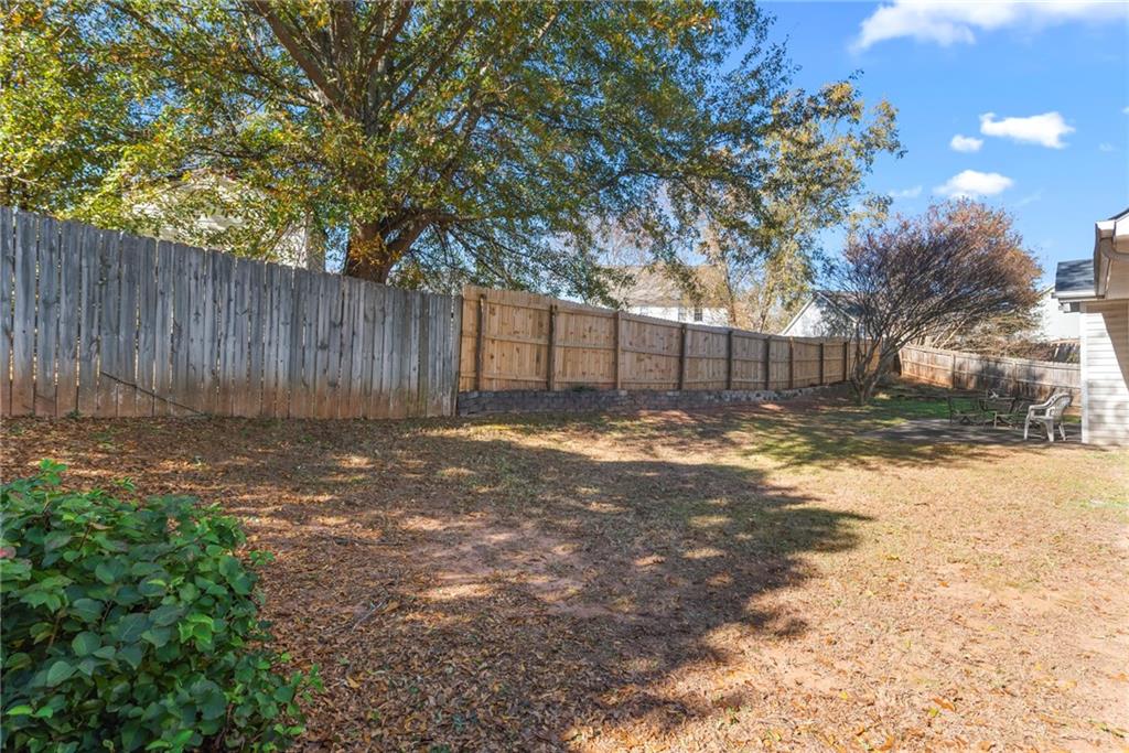 826 Hampton Way Canton, GA 30115 - Photo 17 of 17 a view of a yard with a large tree