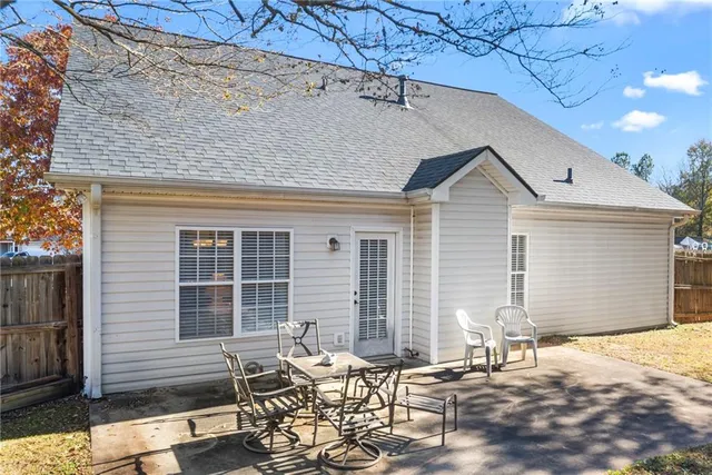 a patio with table and chairs