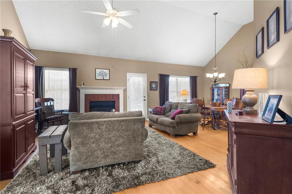 826 Hampton Way Canton, GA 30115 - Photo 4 of 17 a living room with furniture and a fireplace