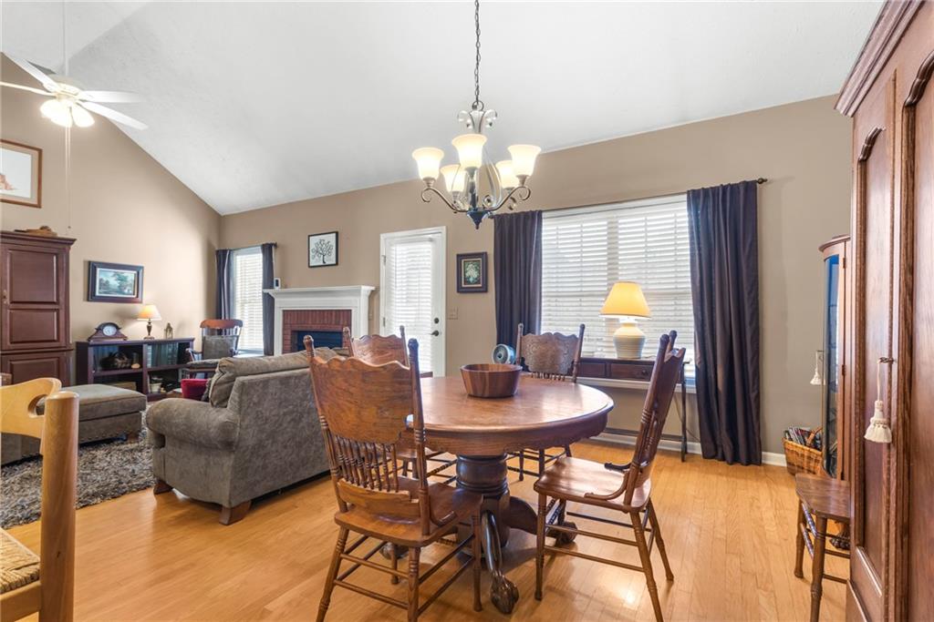 826 Hampton Way Canton, GA 30115 - Photo 7 of 17 a view of a dining room with furniture a chandelier and a window