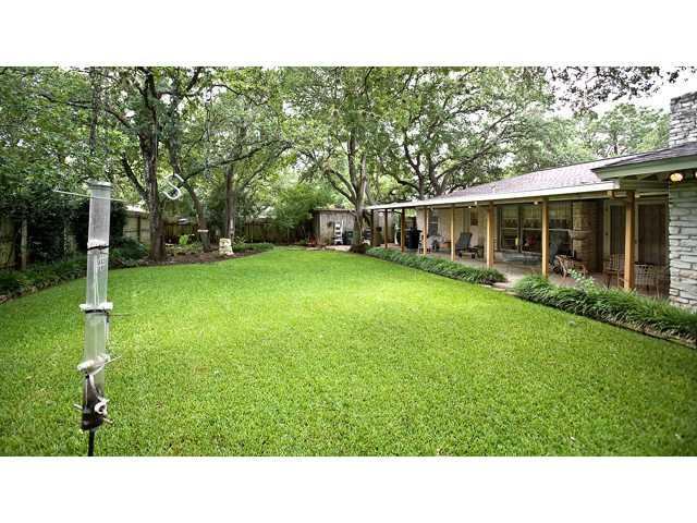 7305 West Rim Drive Austin, TX 78731 - Photo 1 of 1 a black and white photo of a house