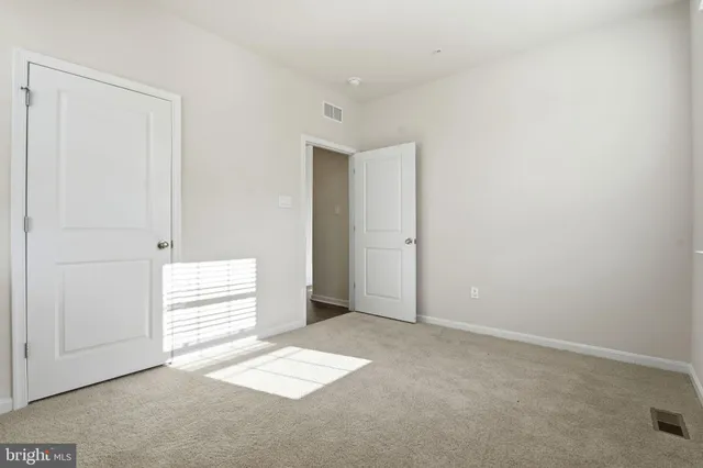 a white toilet sitting next to a bathtub