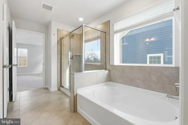 a bathroom with 2 sink and a mirror