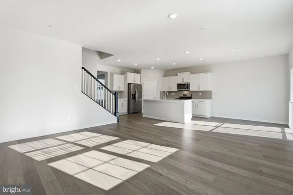 a view of kitchen with wooden floor