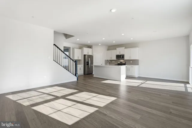 a view of kitchen with wooden floor