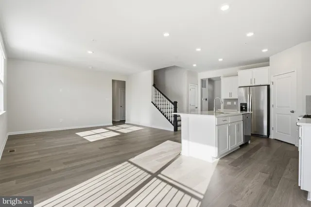 a view of kitchen with furniture and wooden floor