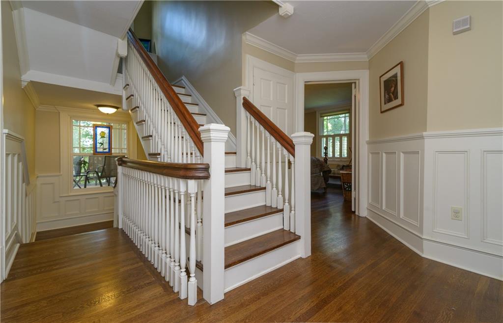 403 Quaker Road Sewickley, PA 15143 - Photo 12 of 24 a view of a hallway with wooden floor and stairs
