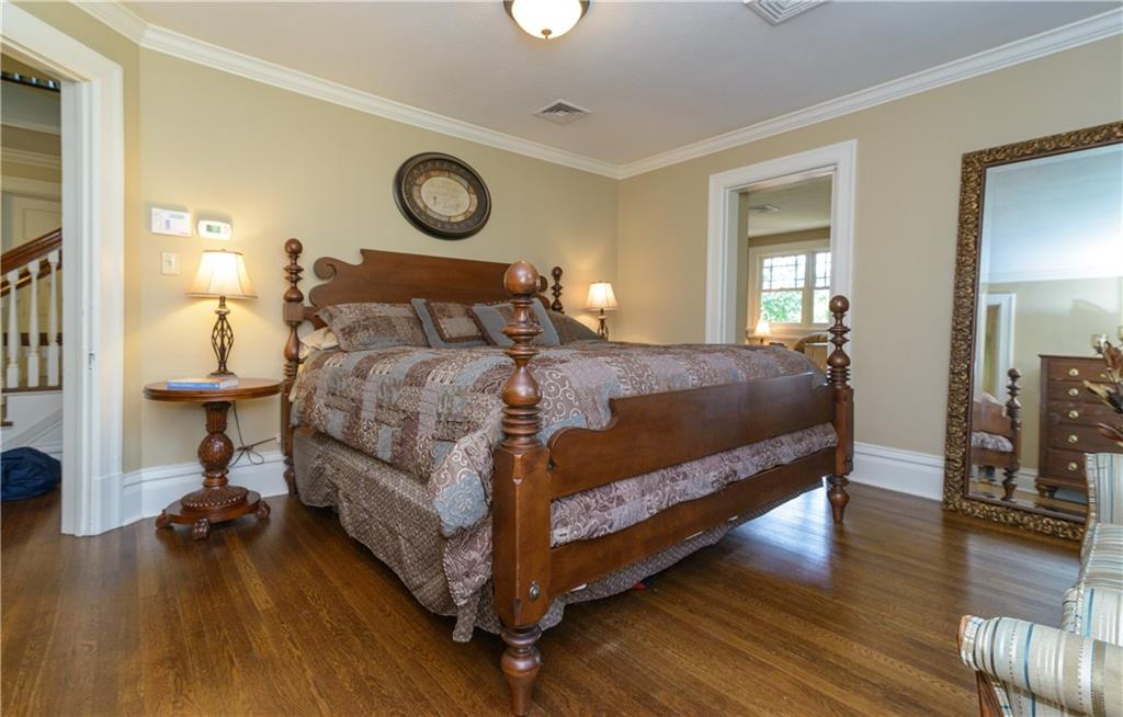 403 Quaker Road Sewickley, PA 15143 - Photo 13 of 24 a bedroom with a bed and wooden floor