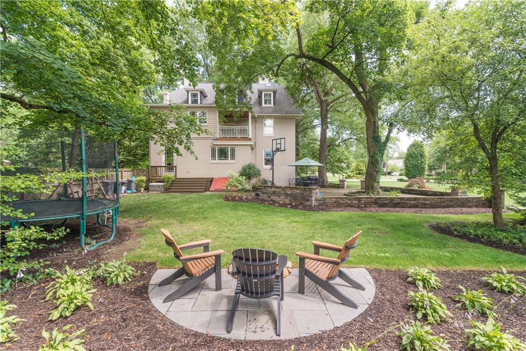 403 Quaker Road Sewickley, PA 15143 - Photo 24 of 24 a view of a house with backyard sitting area and garden