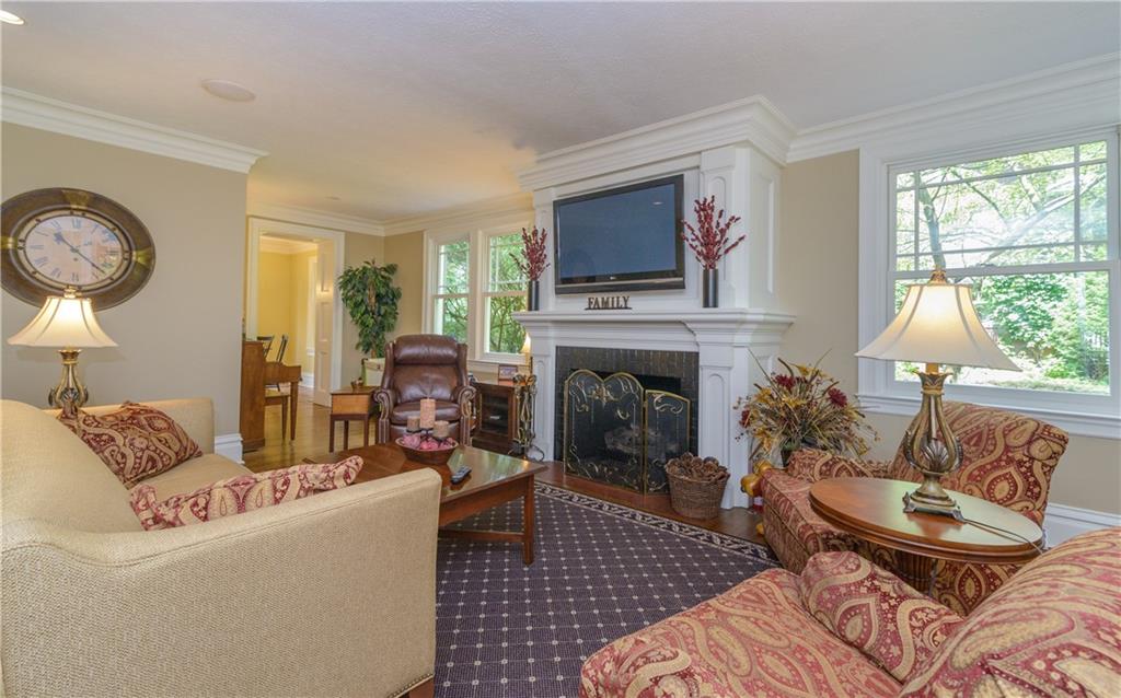 403 Quaker Road Sewickley, PA 15143 - Photo 4 of 24 a living room with furniture fireplace and flat screen tv