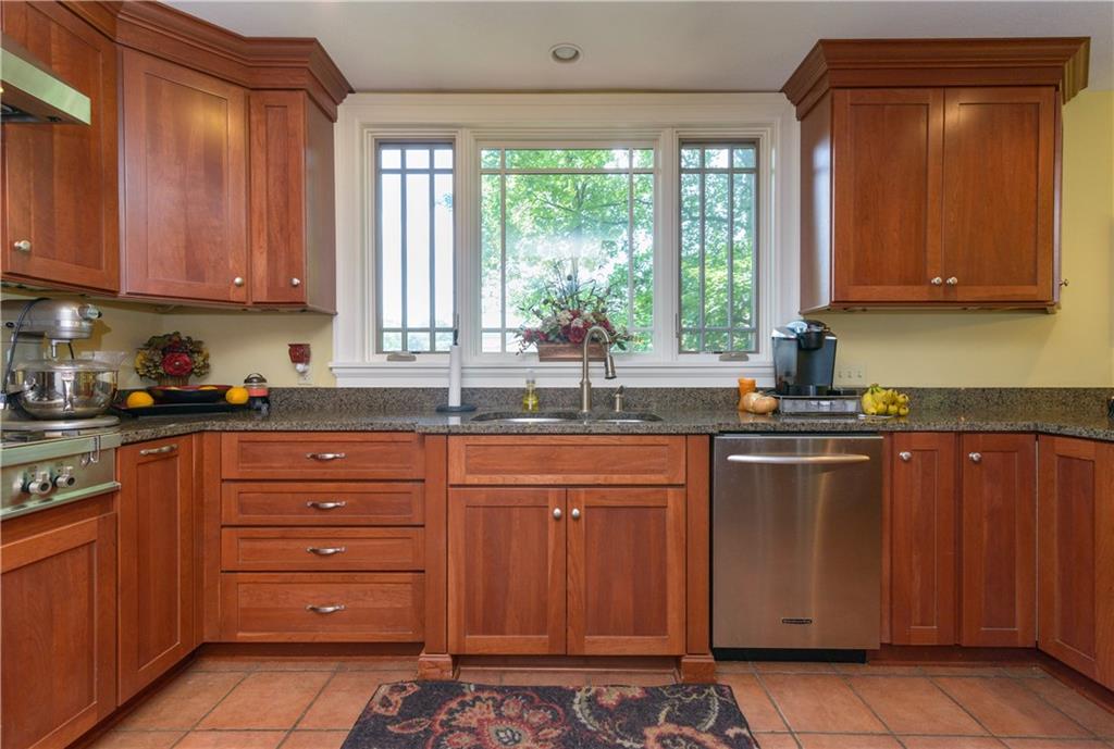 403 Quaker Road Sewickley, PA 15143 - Photo 9 of 24 a kitchen with sink a window and cabinets
