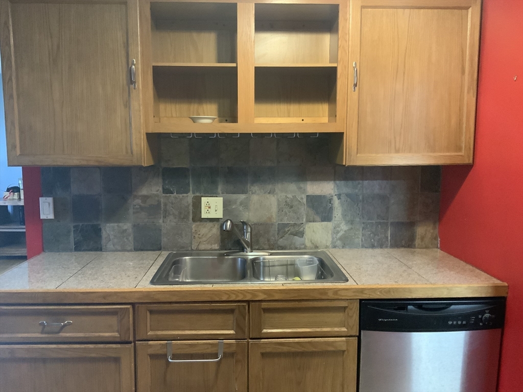 109 Regency Park Drive, Unit 109 Agawam, MA 01001 - Photo 2 of 17 a kitchen with a sink and cabinets