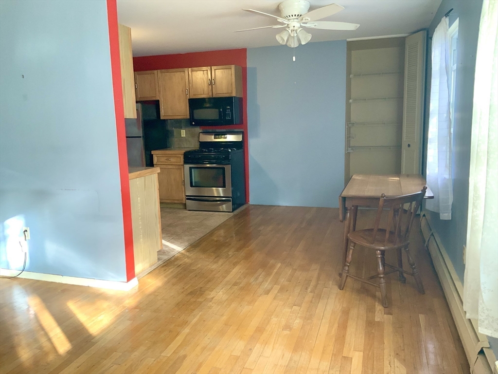 109 Regency Park Drive, Unit 109 Agawam, MA 01001 - Photo 4 of 17 a room with a bed and a mirror