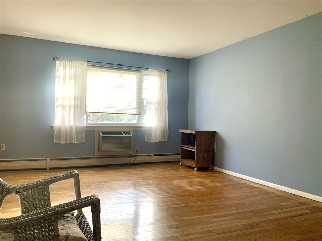 109 Regency Park Drive, Unit 109 Agawam, MA 01001 - Photo 7 of 17 a living room with a window