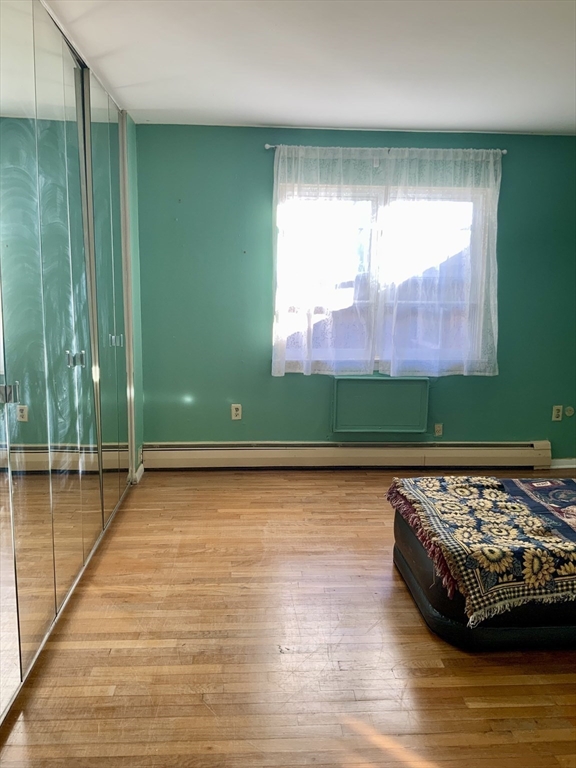 109 Regency Park Drive, Unit 109 Agawam, MA 01001 - Photo 10 of 17 a view of a room with wooden floor and a window