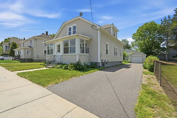 a front view of a house with a yard