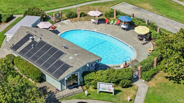 an aerial view of a house with a swimming pool