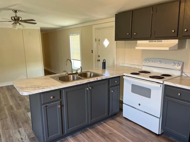 a kitchen with granite countertop a sink cabinets and stainless steel appliances