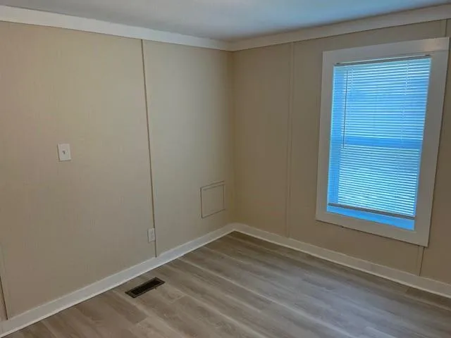a view of a room that has a window in it