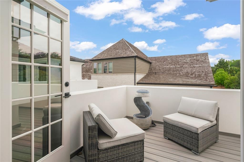 172 High Street Fayetteville, GA 30214 - Photo 11 of 21 a view of a terrace with couches and wooden fence