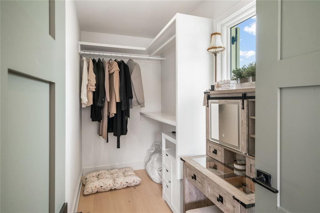 172 High Street Fayetteville, GA 30214 - Photo 18 of 21 a view of walk in closet with clothes and shoes
