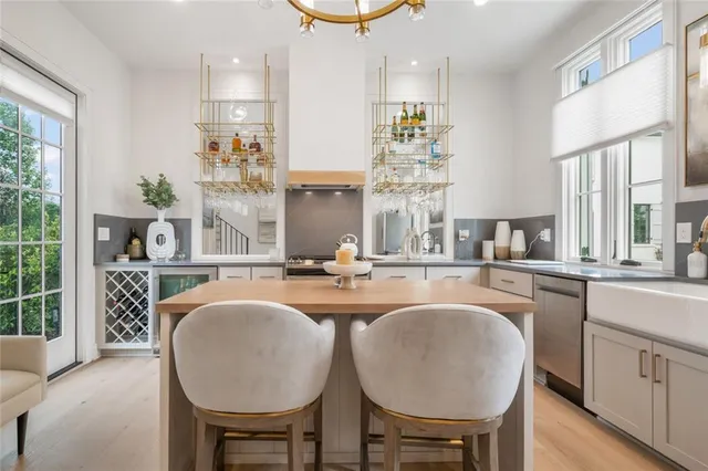 a kitchen with cabinets and window