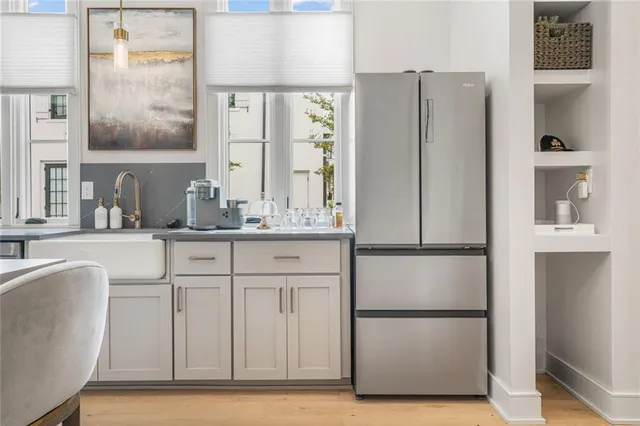a kitchen with stainless steel appliances a refrigerator and a sink