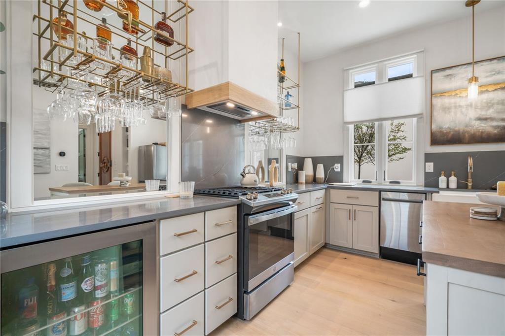 172 High Street Fayetteville, GA 30214 - Photo 4 of 21 a kitchen with stainless steel appliances granite countertop a stove and a sink