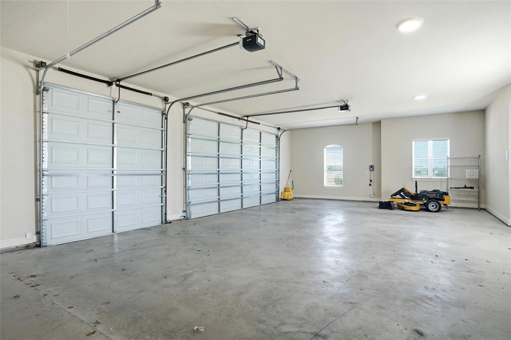 4021 West J E Woody Road Springtown, TX 76082 - Photo 34 of 37 Triple Size Garage with tall ceiling room for an RV