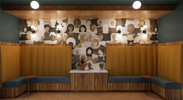 a living room with a couch and a potted plant