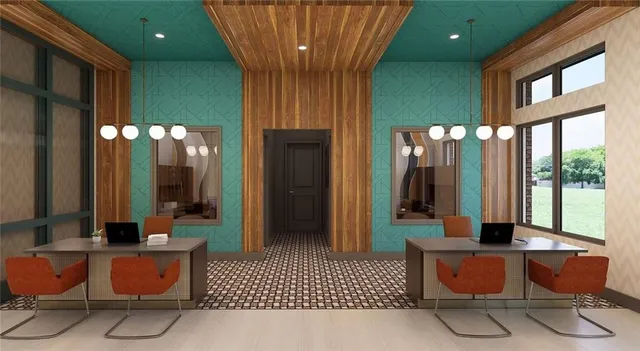 a lobby with furniture and large windows